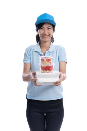 female delivery courier bring groceriesの写真素材