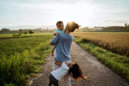 mother and baby playing together outdoorの写真素材