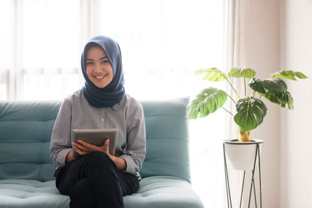 portrait of a beautiful Muslim woman who is very happy and enthusiastic about working