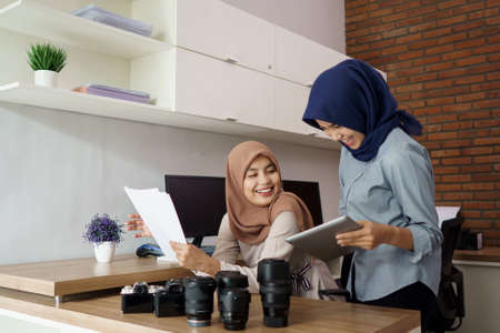 portrait of beautiful muslim woman who is very happy to see the results of her effortsの写真素材