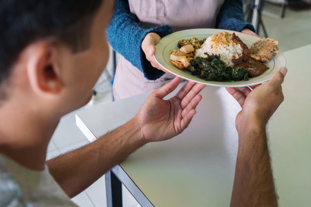 a woman give a dish traditional food