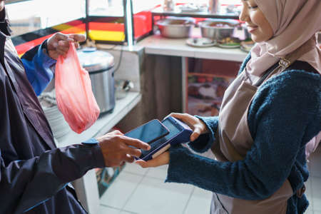 a man pays for foodの写真素材