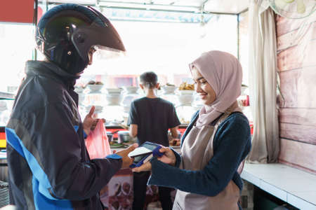 a man pays for foodの写真素材