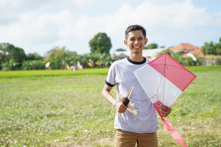 portrait young man ready playing kites