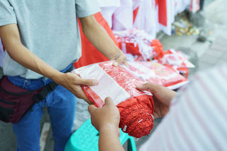 a man giving a flagの写真素材