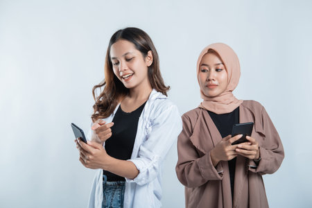 woman getting happy messages on a cellphone with college friends curious