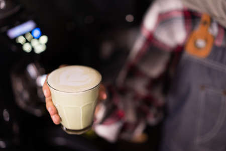 Hand holding cup of coffee.の写真素材