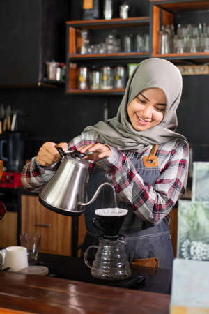 barista make a coffee progress.の写真素材