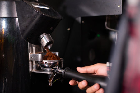 Barista making coffee progress.