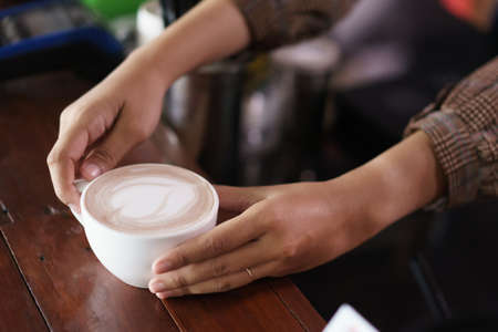 hand holding coffee cup.の写真素材