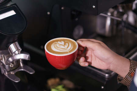 hand holding coffee background.の写真素材