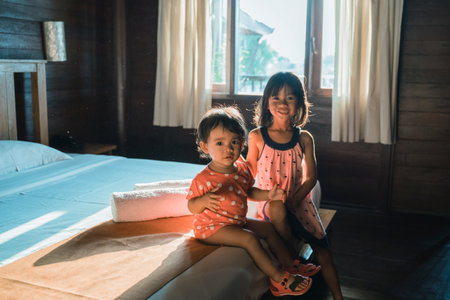 Portrait happy little sisterの写真素材