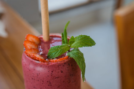 Close up fresh guava fruit juice is served in a glass