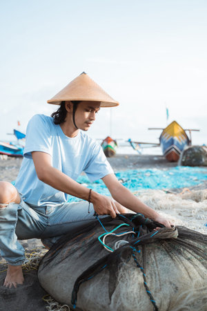 Portrait of a young male fishermanの写真素材