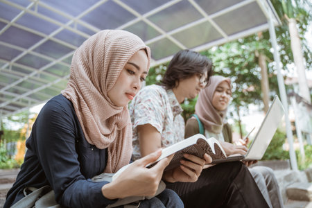 Portrait Muslim female student reading a book.の写真素材