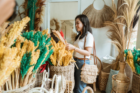 beautiful female holding a flower craftsの写真素材
