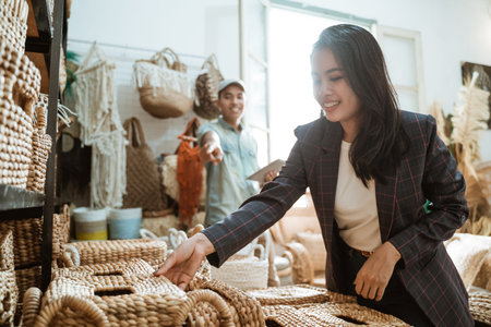 woman entrepreneurs pick up boxes and man list items