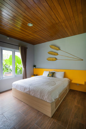 wooden bed in minimal bedroom interior