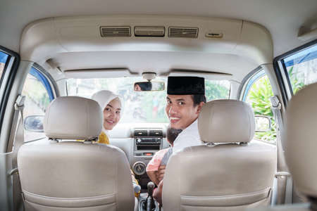 Muslim family travel by car during eid mubarak celebrationの写真素材