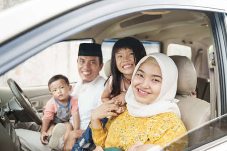 Muslim family travel by car during eid mubarak celebrationの写真素材