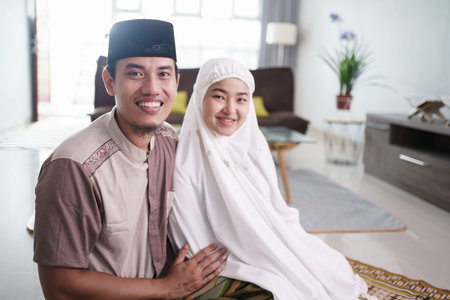 asian muslim couple after praying together at home