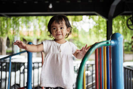happy toddler on the playgroundの写真素材