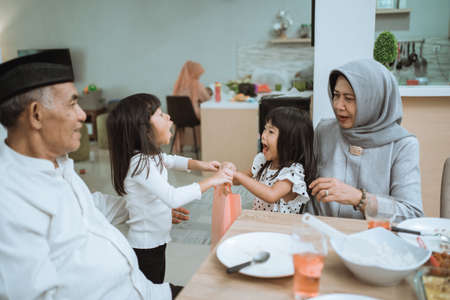 asian grandparents and grandchildren enjoying their time togetherの写真素材