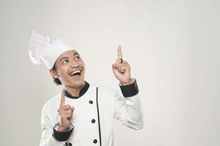portrait of asian Smiling chef. Isolated over white background. Gourmet.の写真素材