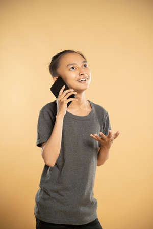 man using mobile phone at studioの写真素材