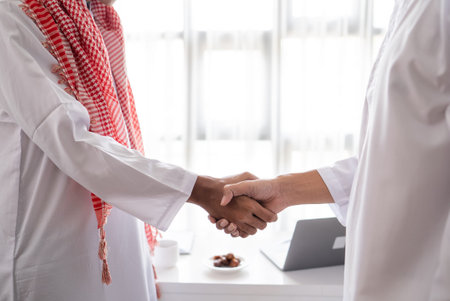 portrait of business muslim partner shaking hand in the meeting