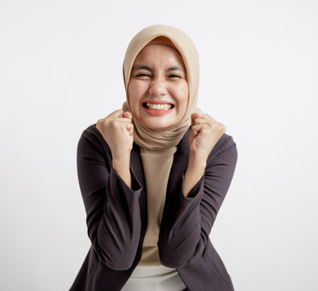 woman entrepreneur wearing hijab exasperated expression office work concept isolated white backgroundの写真素材