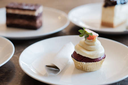 A slice of delicious cup cake. Piece of cup Cake on a Plate. Sweet food. Sweet dessert. Close up.の写真素材