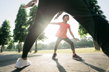 asian father and daughter do exercises catch and play together. Healthy lifestyle of family with...