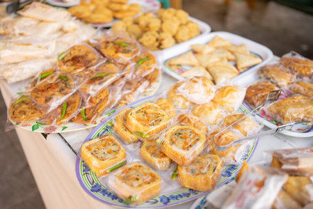 various kinds of traditional Indonesian fries, fried food wrapped in plastic on a serving plate on the tableの写真素材