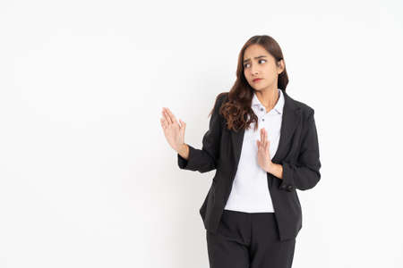 Young businesswoman wearing black suit smiling with hand gesture rejecting with copyspaceの写真素材