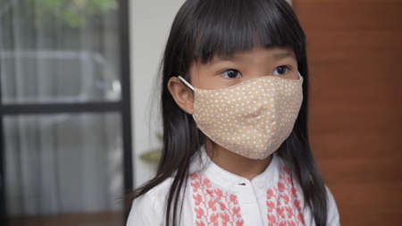Kids wearing the mask for protect them self from virus and air pollutionの写真素材