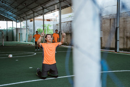 Confident players after scoring a goal prostrate themselvesの写真素材