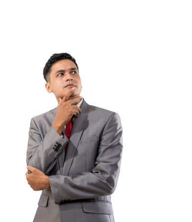 businessman thinking while looking up to copyspaceの写真素材