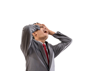 businessman in his suit feeling stressed hold his head