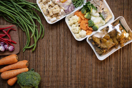 Fresh broccoli, carrots and other foodstuffs are wrapped with copyspaceの写真素材