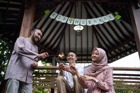 joy of father, mother and son when lighting fireworks togetherの写真素材