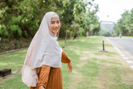 beautiful muslim asian woman wearing scarf outdoorの写真素材