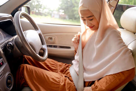 young muslim asian woman driving a carの写真素材