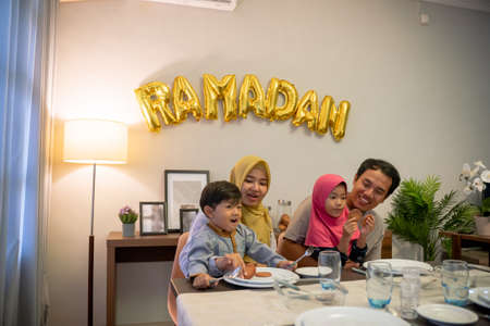 muslim asian family breaking the fast togetherの写真素材