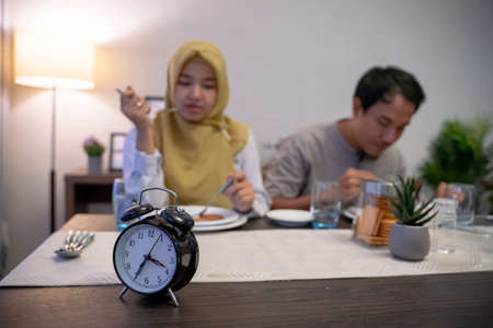 muslim couple having breakfast or sahurの写真素材