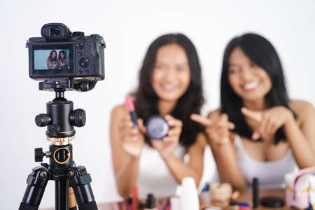 beautiful Asian woman beauty vlogger or blogger recording make up tutorialの写真素材