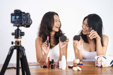 beautiful Asian woman beauty vlogger or blogger recording make up tutorialの写真素材