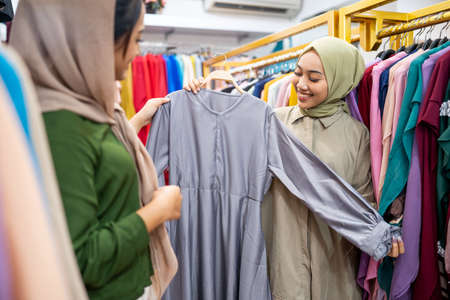 beautiful muslim female shopping with friend togetherの写真素材