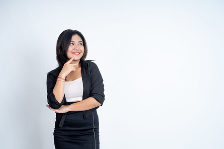 asian woman with long hair smiling while standingの写真素材