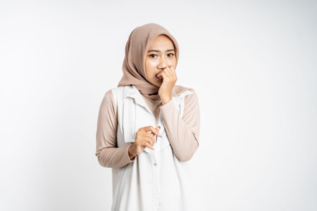 worried muslim asian woman gesture on isolated background